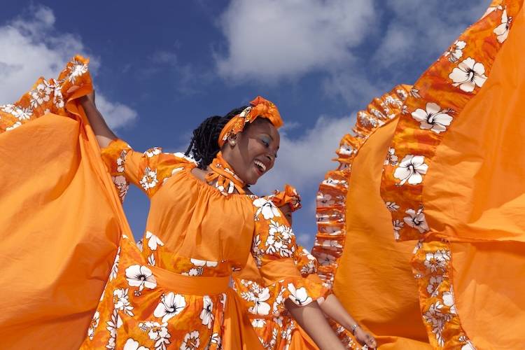 Caribbean performers dancing during a festival