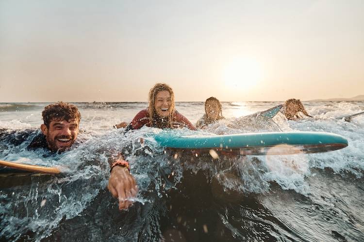 Group of friendsnparticipating in Folly Beach surfing event