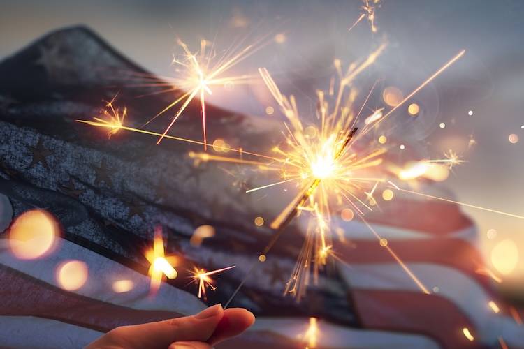 Sparkler and flag in celebration of the 4th of July