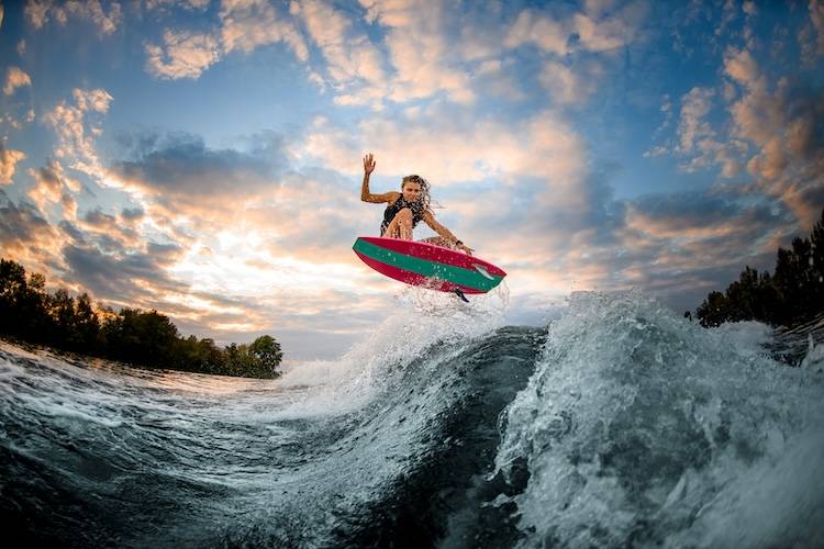 Woman participating in the Wahine surfing event