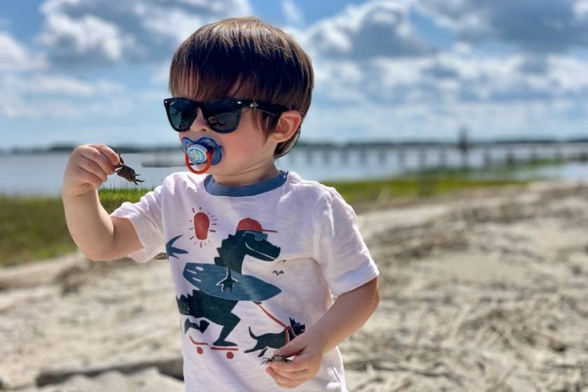 boy shelling at Folly Beach